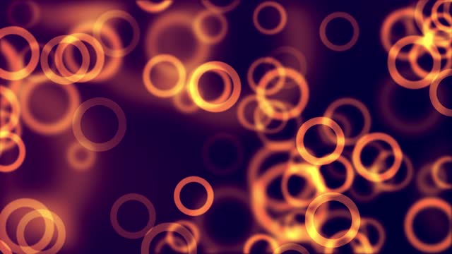 A looped abstract light background with a bokeh effect, featuring blue particles stock video