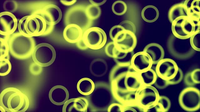 A looped abstract light background with a bokeh effect, featuring blue particles stock video