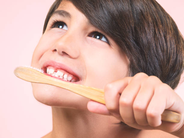 istock Close-up of a child's face brushing his teeth. 1680291931