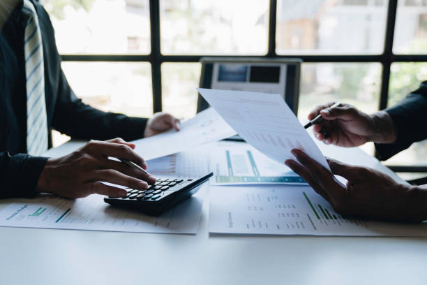 istock Financial analyst analysis business financial report on digital tablet during discussion at meeting of corporate showing the results of their successful teamwork., business meeting concept, Marketing 1680292386