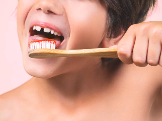 istock Close-up of a child's mouth brushing his teeth. 1680292945