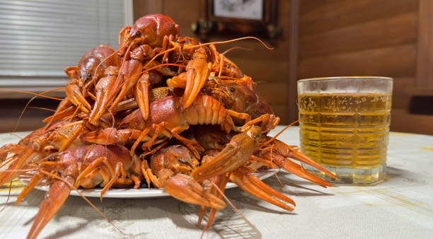 istock Lobster on plate on table. Crawfish Snack to beer. Crayfish Beer snack dish. 1680296259