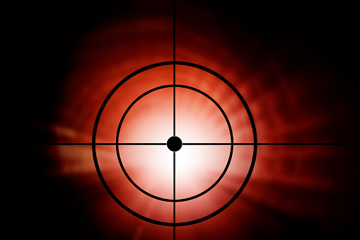Red blurred dot with crosshairs as light effect