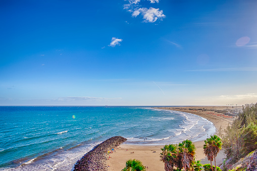 Picturesque View of Playa del Ingles Beach in Maspalomas With Sand Dunes and Palms Trees at Gran Canaria in Spain.Horizontal image