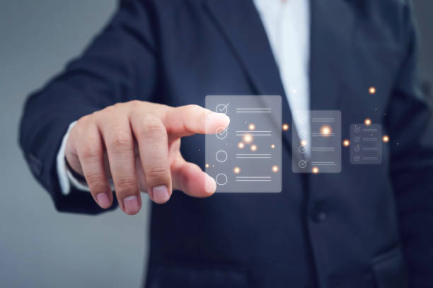 istock Business performance checklist, Quick checklist and clipboard management concept, job applicants, businessman hand shows doing online checklist survey,Employees must complete the online survey form. 1680320920