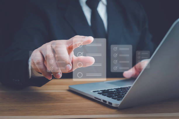 istock Business performance checklist, Quick checklist and clipboard management concept, job applicants, businessman using laptop doing online checklist survey,Employees must complete the online survey form. 1680320960