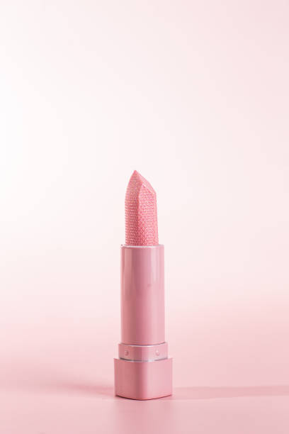 istock Pink pearlescent lipstick on a pink background 1680323729