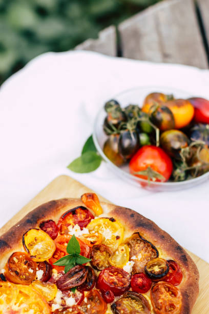 istock pie baked in the oven with multi-colored tomatoes on top 1680366457