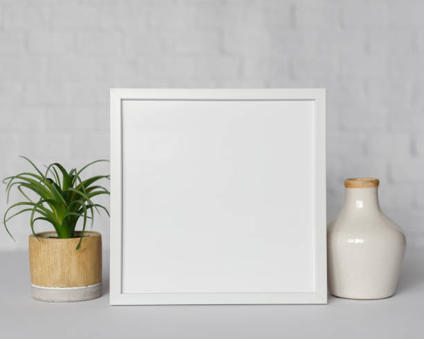 istock Minimal wooden picture poster frame mockup on white wallpaper 1680369820