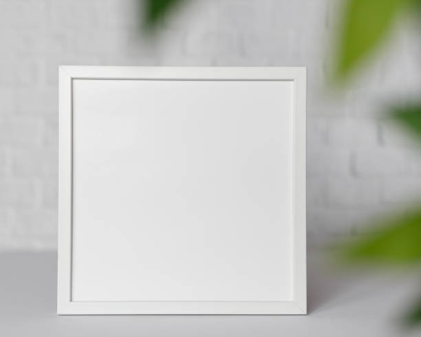 istock Minimal wooden picture poster frame mockup on white wallpaper 1680370363