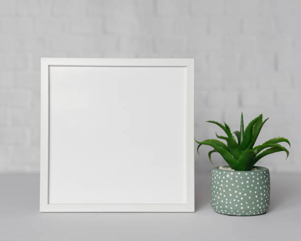 istock Minimal wooden picture poster frame mockup on white wallpaper 1680370979