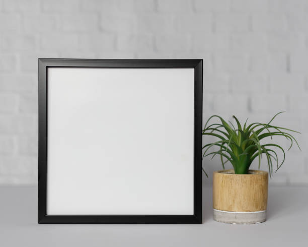 istock Minimal wooden picture poster frame mockup on white wallpaper 1680373432