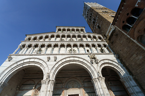 Lucca, Italy - June 27, 2023: Exterior of the Duomo of Lucca,  Tuscany, Italy, medieval building