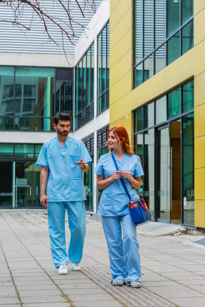 istock heterosexual latin couple walk through the streets to get to their workplace while talking 1680412350