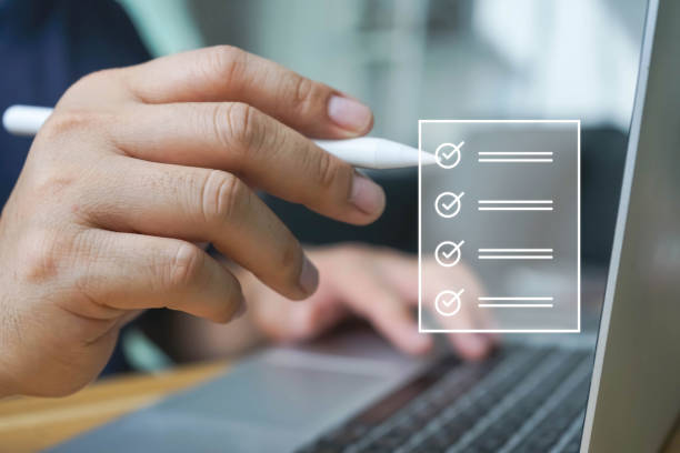 istock Business performance checklist, Quick checklist and clipboard management concept, job applicants, businessman using laptop doing online checklist survey,Employees must complete the online survey form. 1680419670