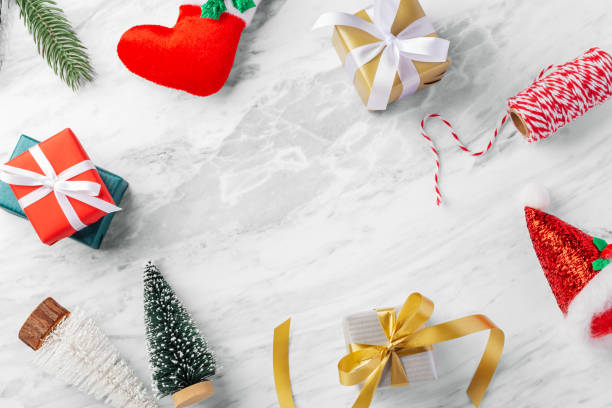 istock Christmas background with gift box, presents and christmas decoration on white marble table 1680433202