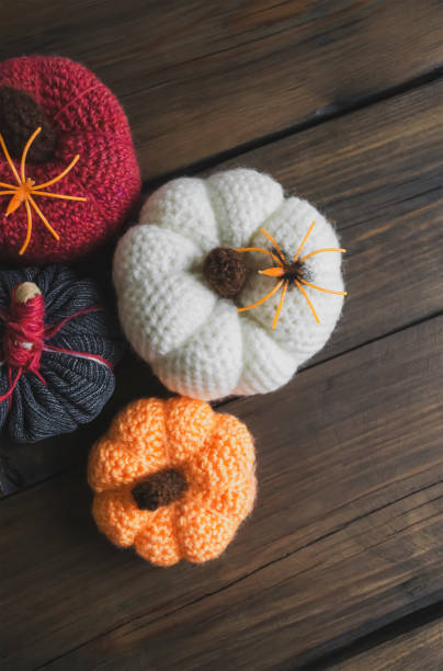 istock There are spiders on pumpkins. Halloween decorations - crocheted pumpkins and artificial spiders. 1680436698
