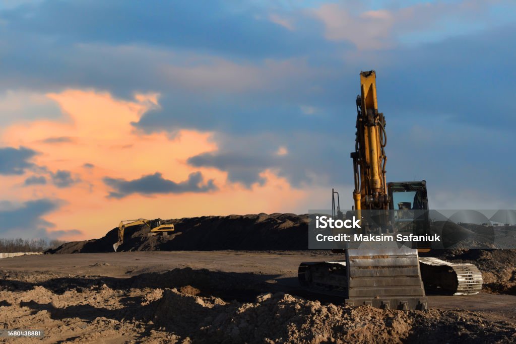 Backhoe Digging Sand Excavator On Earthmoving At Open Pit Mining Backhoe Dig Sand And Gravel ...