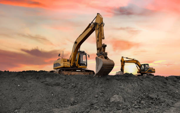 istock Excavator on earthmoving at open pit mining. Backhoe dig ore in quarry on sunset. 1680441612