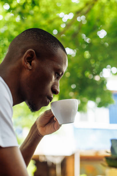 istock Confident and successful multiracial businessman drinking coffee and work, chatting online using laptop in street cafe 1680449678