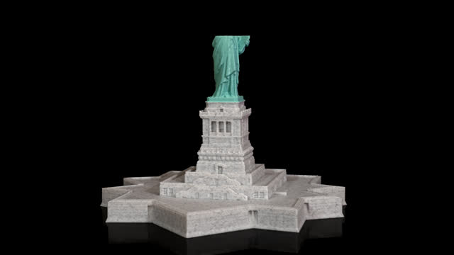 3D printer printing Statue of Liberty time lapse on pure black background