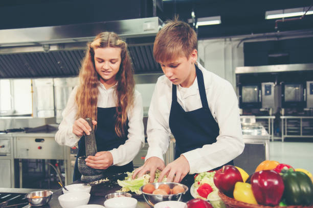 istock the group children in class kitchen room. Chef preparing student for learning marking and cooking food at workshop. 1680469322