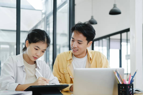 istock Young students campus helps friend catching up and learning. 1680474492