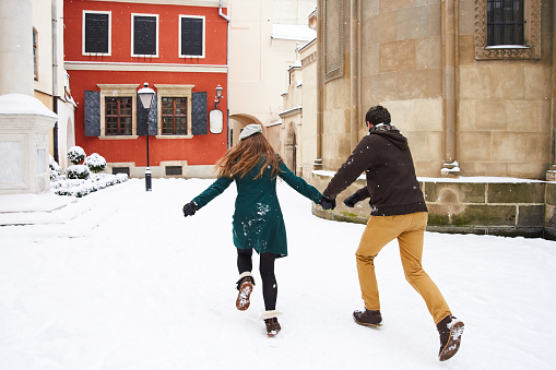 couple in love walking in city in winter vacation and holidays. Trip to Europe