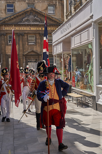 Bath, England, United Kingdom - 9 September 2023: Parade of people dressed in period costume from the Georgian era as part of the annual Jane Austen festival in Bath in Somerset, United Kingdom