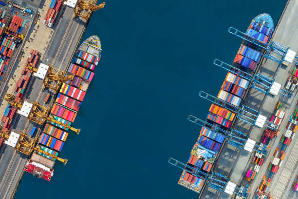 istock Industrial import-export port prepare to load containers. Aerial top view container ship in export and import global business and logistic. Global transportation and logistic business. 1680507858