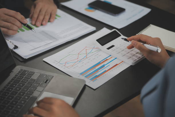 istock Financial Business team present. Business man hands hold documents with financial statistic stock photo, discussion, and analysis report data the charts and graphs. Finance Financial concept 1680513407