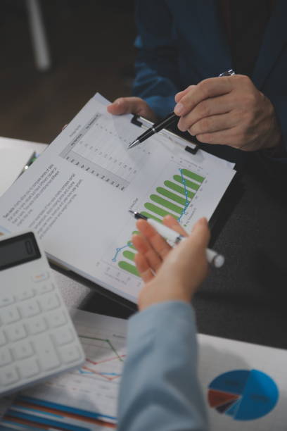 istock Financial Business team present. Business man hands hold documents with financial statistic stock photo, discussion, and analysis report data the charts and graphs. Finance Financial concept 1680513972