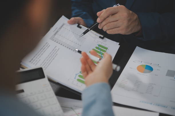 istock Financial Business team present. Business man hands hold documents with financial statistic stock photo, discussion, and analysis report data the charts and graphs. Finance Financial concept 1680515702