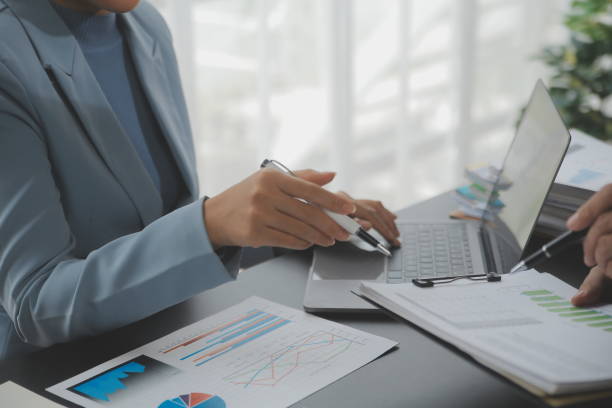 istock Financial Business team present. Business man hands hold documents with financial statistic stock photo, discussion, and analysis report data the charts and graphs. Finance Financial concept 1680525914