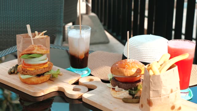 Juicy burgers and iced drinks - watermelon shake and iced latte in beach resort