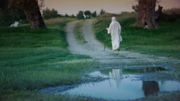 istock A Pilgrim leaves on a muddy road at night 1680539597