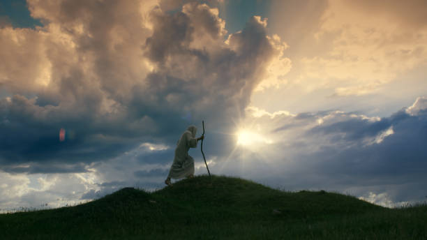 istock Christ silhouette ascending a hill shrouded in twilight 1680540139