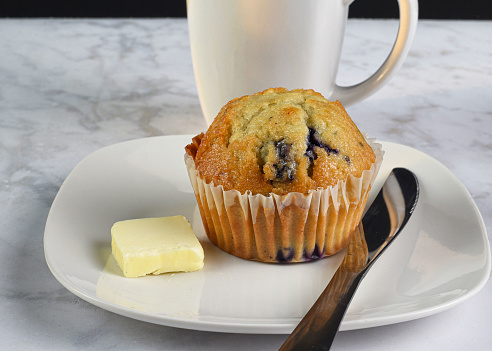 blueberry muffin  served with a fresh cup of coffee