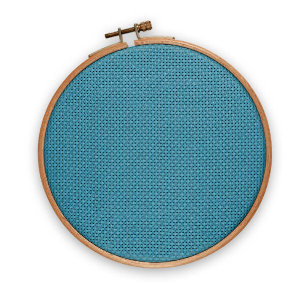 istock Blue canvas in embroidery hoop on white background. Accessory for cross-stitch. Save with adding the clipping path 1680543520