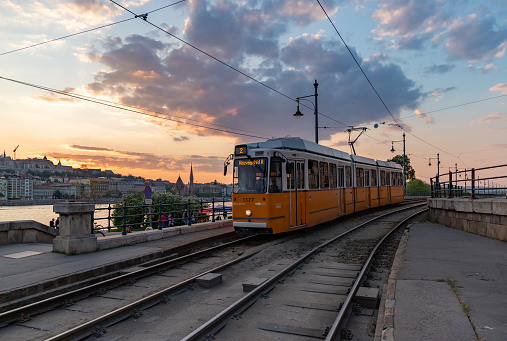 Budapest, Hungary - April 22, 2023: A picture of the iconic Budapest Tram number 2 at sunset.