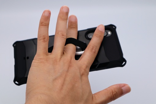 Photo of a person using a smartphone band