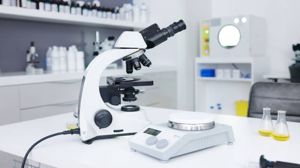 istock Microscope, science and closeup backgrounds for investigation, expert analytics or medical study. Laboratory equipment, microbiology and magnifying tools of test, stem innovation or medicine research 1680607572