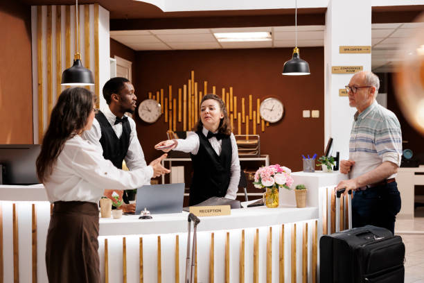 istock Concierge confirms hotel reservation 1680609297