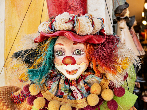 Traditional style of clown marionette with strings is for sale in a shop in Oia on the island of Santorini.