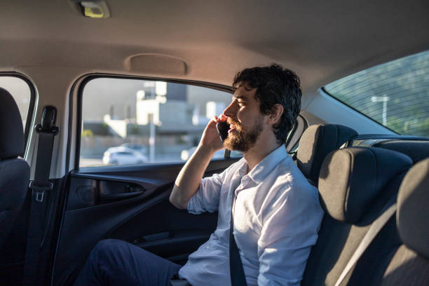 istock Man talking on cell phone in car 1680639085