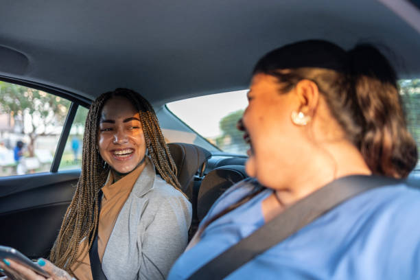 istock Smiling female passengers in car via app 1680640164