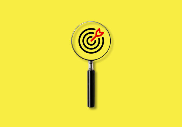 istock Magnifying glass with aiming dart board icon with copy space on yellow background, Focusing, finding or analyzing business goals and targets concept. 1680640187