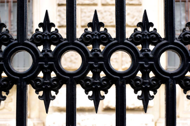 istock black cast iron fence close-up or macro. front view. 1680691661