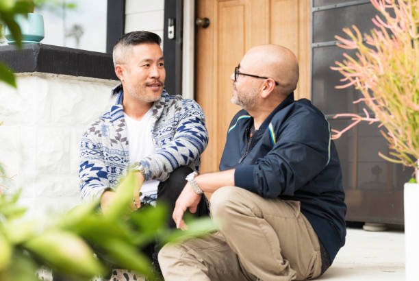 istock Couple chatting at the front of their home 1680708692