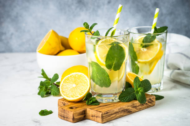 istock Lemonad in the glass at white table. 1680714597